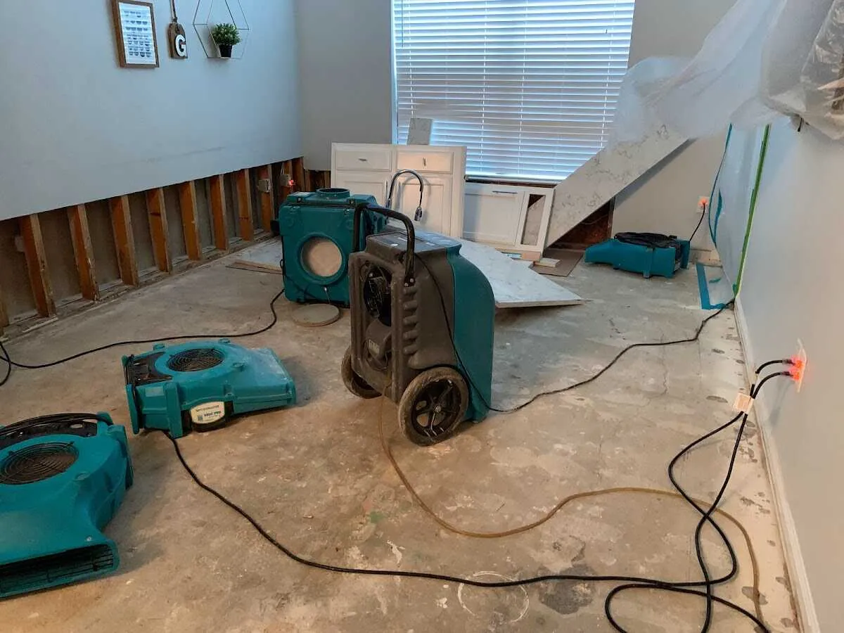 Dehumidifier in flood-cut room for Water Damage Restoration in Handy